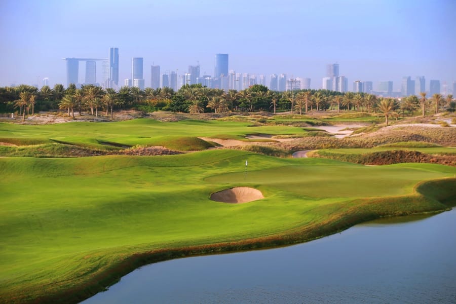 view of abu dhabi skyline from saadiyat beach golf club