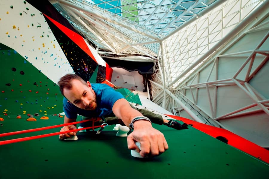 man on climbing wall at clymb in abu dhabi