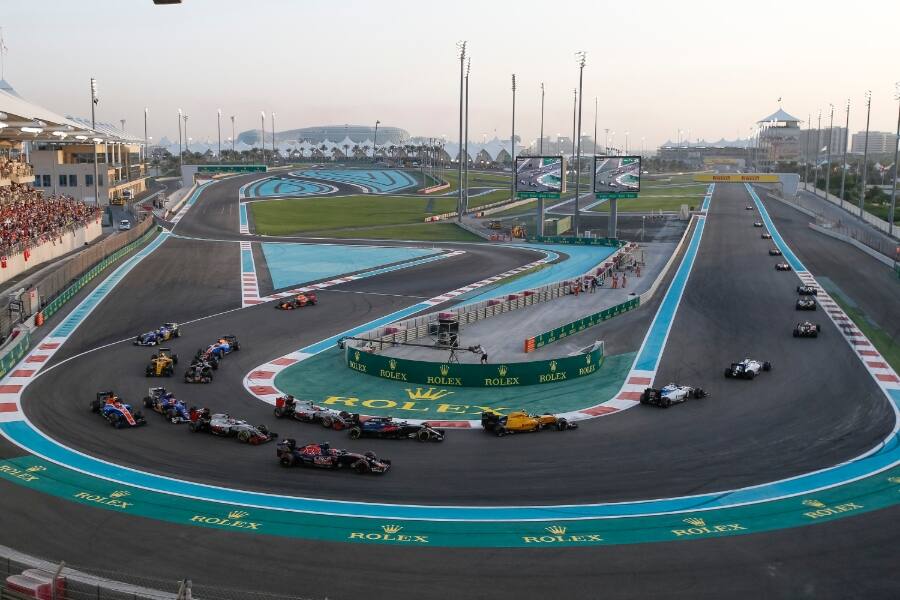 cars racing on yas marina circuit