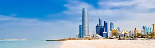 corniche beach with abu dhabi skyline