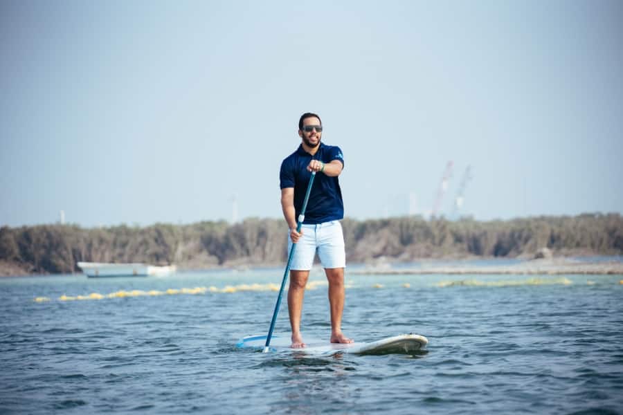 man stood on paddleboard 