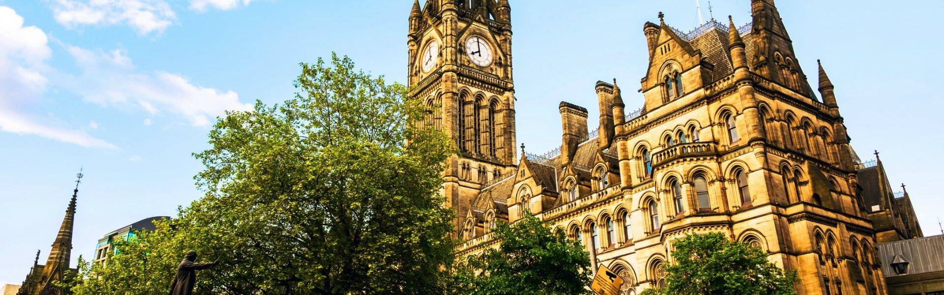 view of manchester town hall on a sunny day