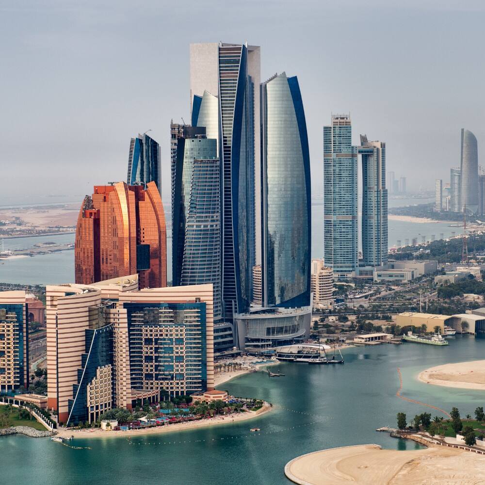 helicopter point of view of abu dhabi skyline with surrounding area