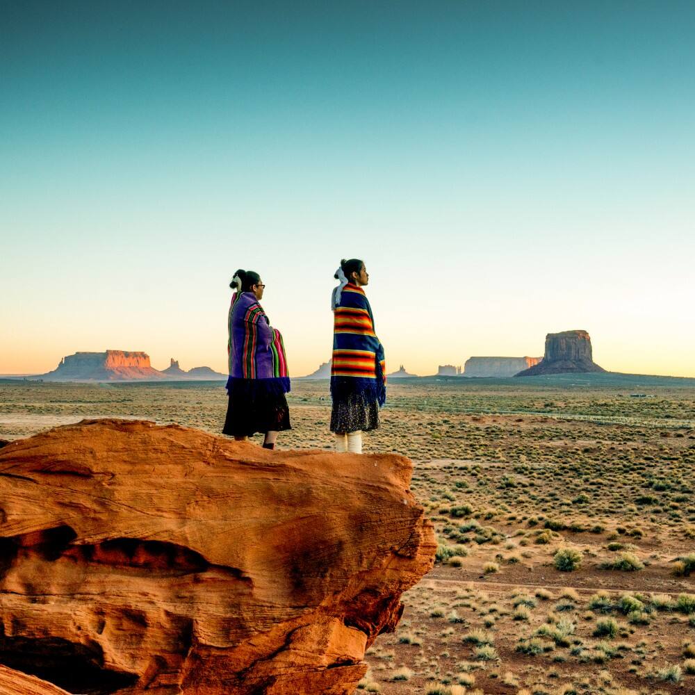two traditional navajo native american sisters in monument valley tribal park usa
