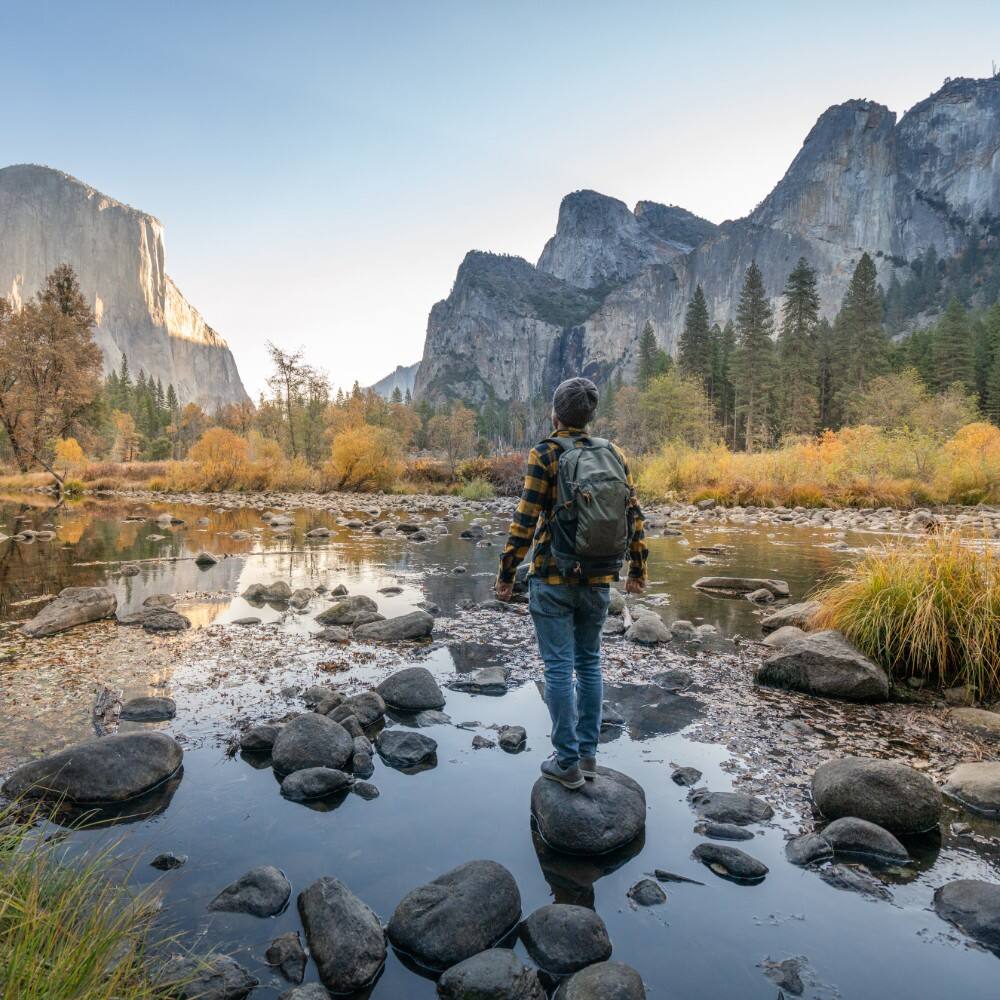 man exploring yosemite valley from the river usa