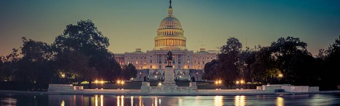 the united states capitol in washington dc lit up at night