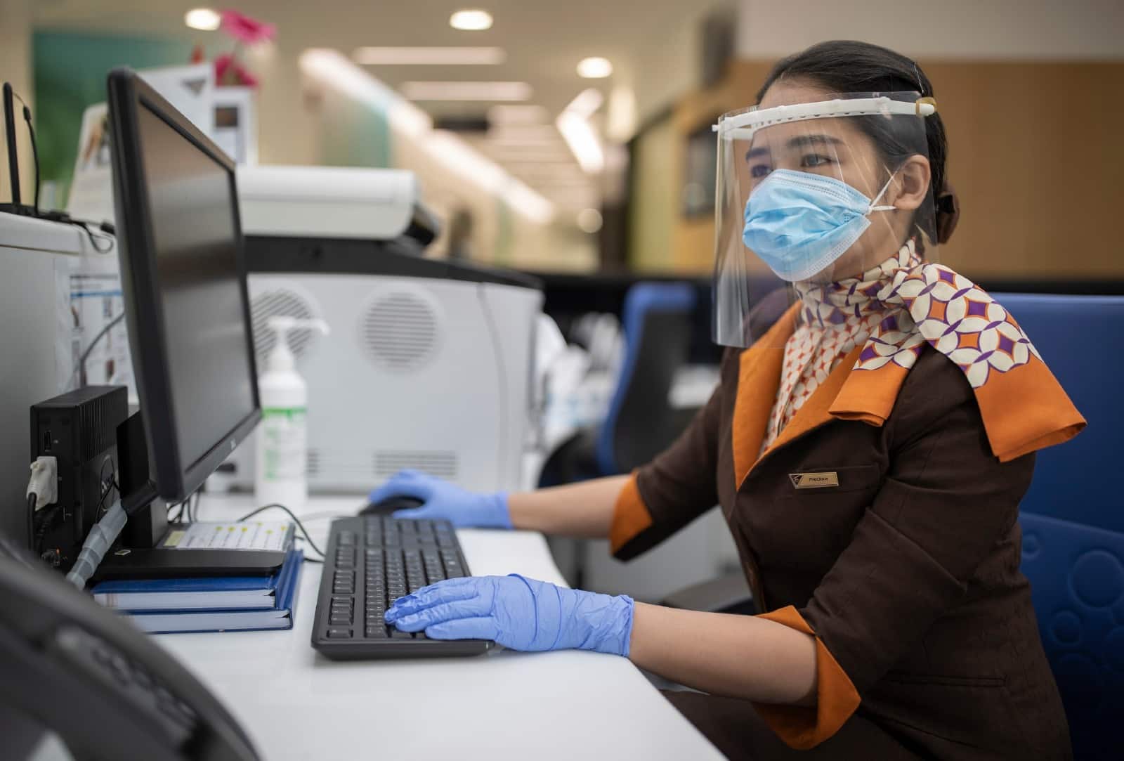 guest-service-agent-at-etihad-airways-medical-centre-wearing-face-shield