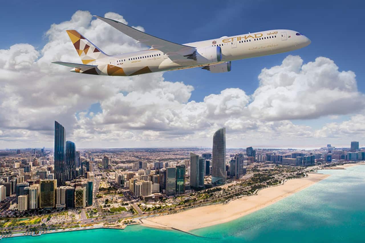 https://www.etihad.com/content/dam/eag/etihadairways/etihadcom/Global/products/fleet/etihad-flight-flying-overabu-dhabiskyline.jpg?utm_source=chatgpt.com