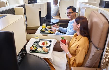 guests enjoying business class meal in etihad