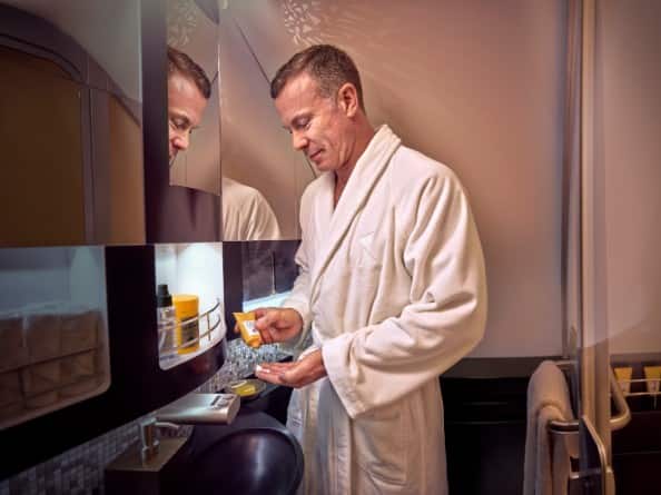 male guest applying cologne