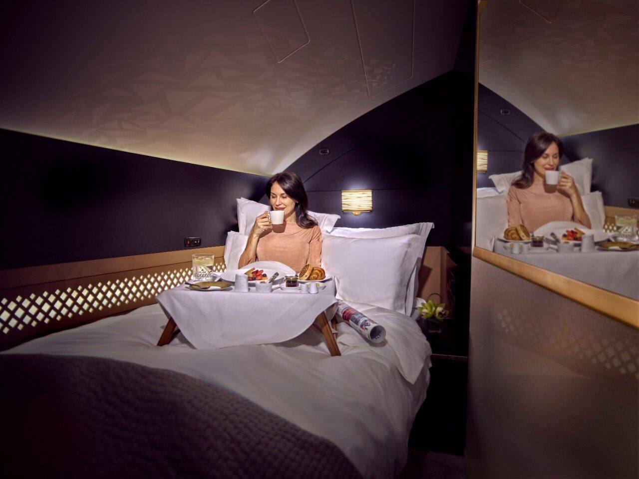 female guest enjoying a meal in the residence bed